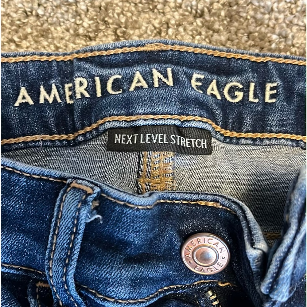 American eagle dark wash ripped jeans size 2. Mildly worn